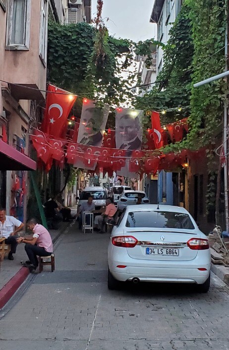 Residential street of homes in Istanbul hung with garlands of the Turkish flag